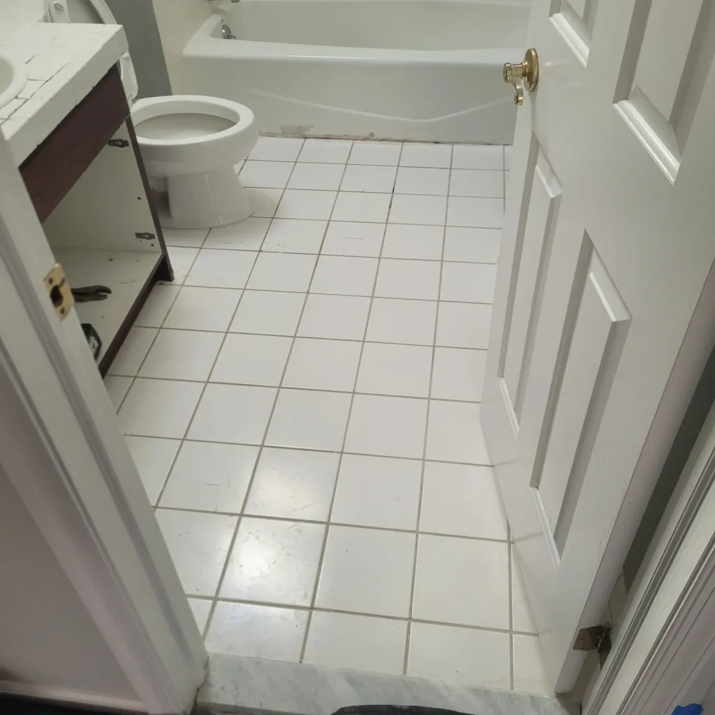 Bathroom renovation in New Jersey — original tile floor before renovation